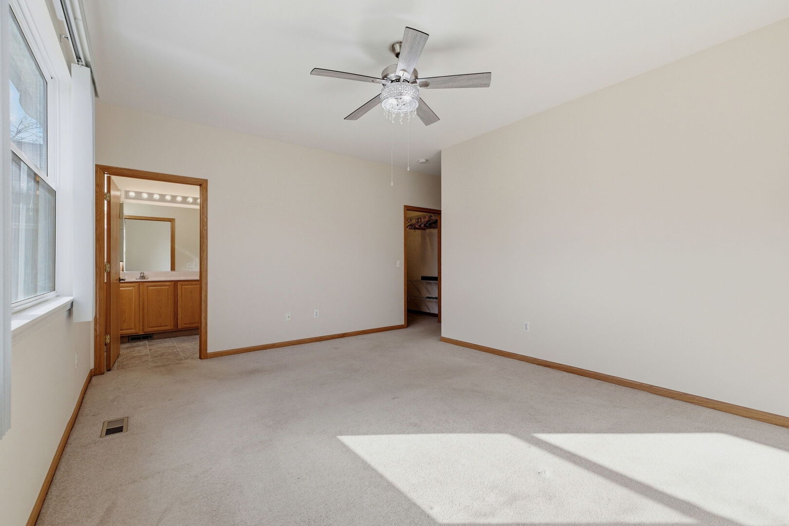 1547 Cadillac Circle Romeoville, IL 60446 - Photo 13 of 21 an empty room with closet and a ceiling fan