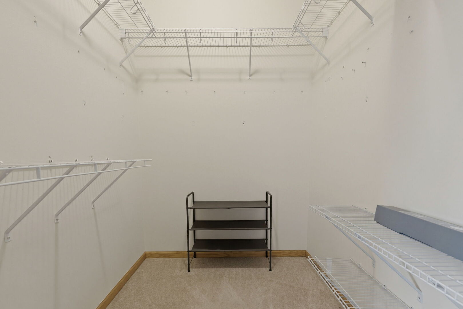 1547 Cadillac Circle Romeoville, IL 60446 - Photo 14 of 21 a view of a room with racks on the wall