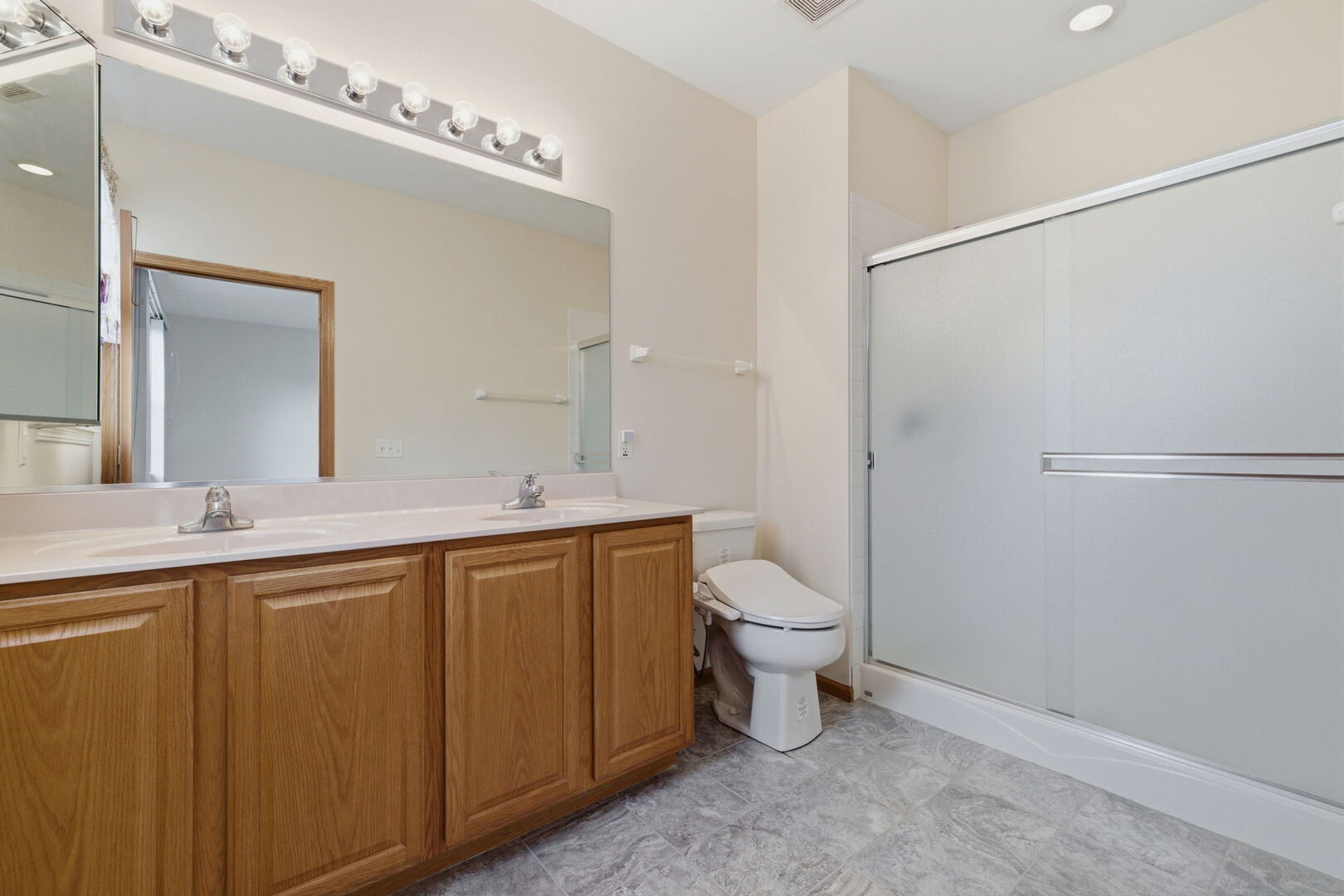 1547 Cadillac Circle Romeoville, IL 60446 - Photo 15 of 21 a bathroom with a toilet a sink and mirror