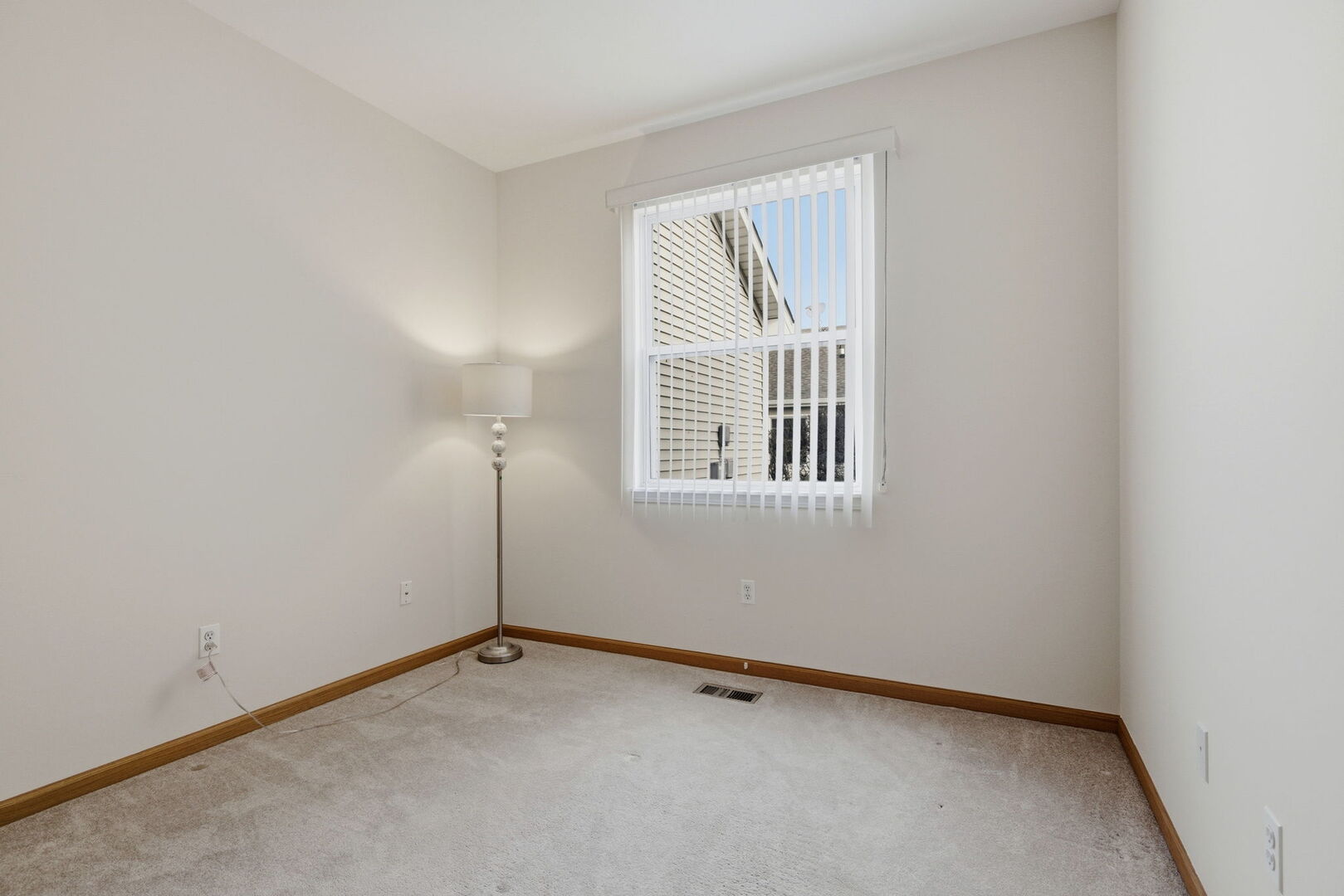 1547 Cadillac Circle Romeoville, IL 60446 - Photo 16 of 21 a view of an empty room with a window