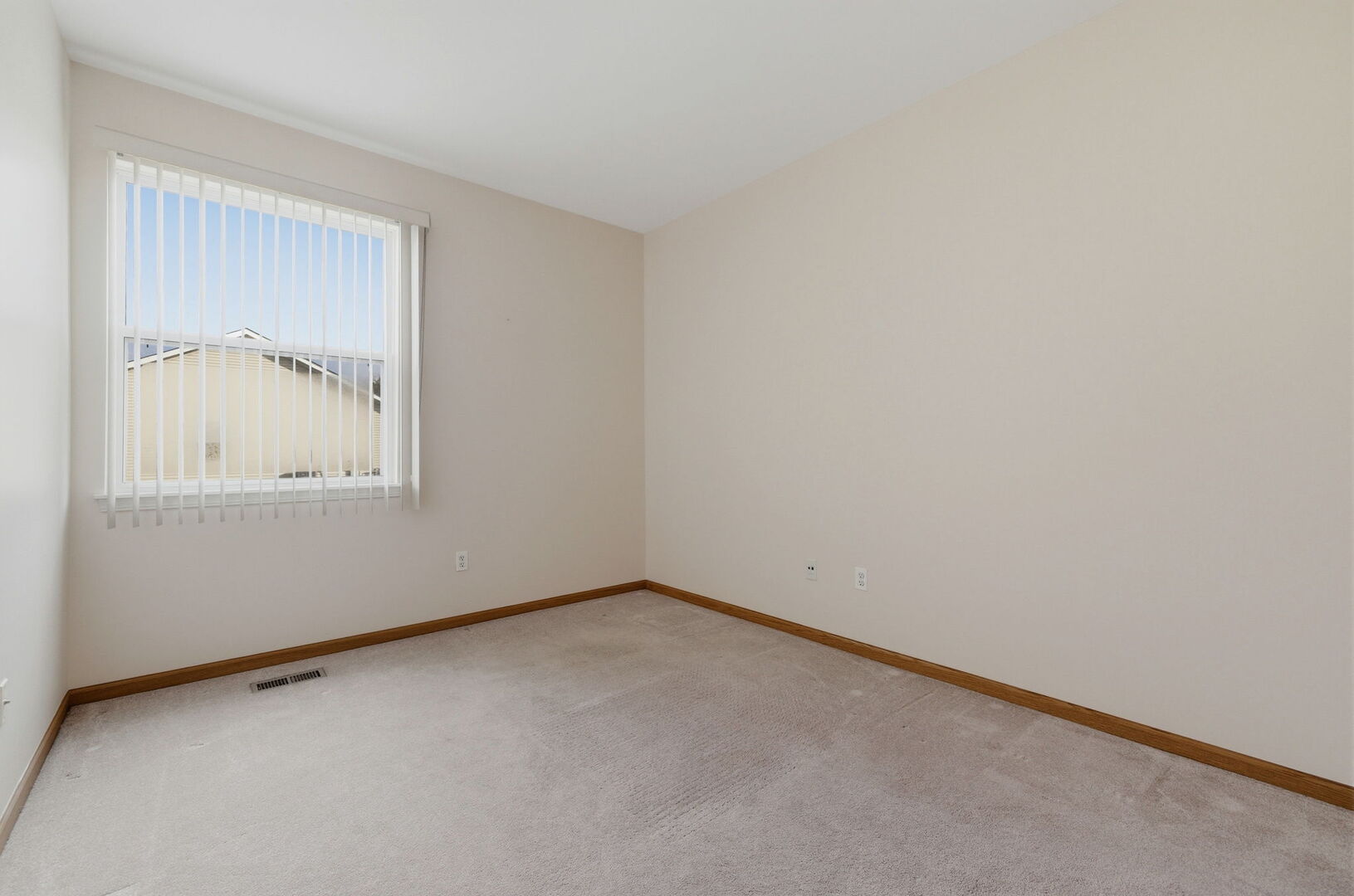 1547 Cadillac Circle Romeoville, IL 60446 - Photo 17 of 21 an empty room with a window