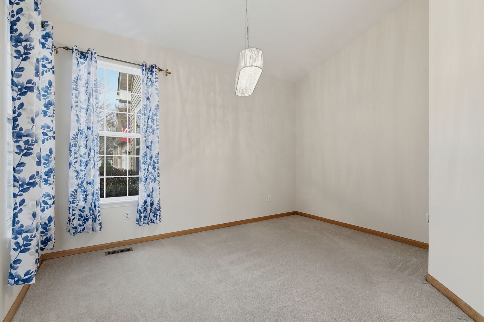 1547 Cadillac Circle Romeoville, IL 60446 - Photo 4 of 21 a view of an empty room with a window