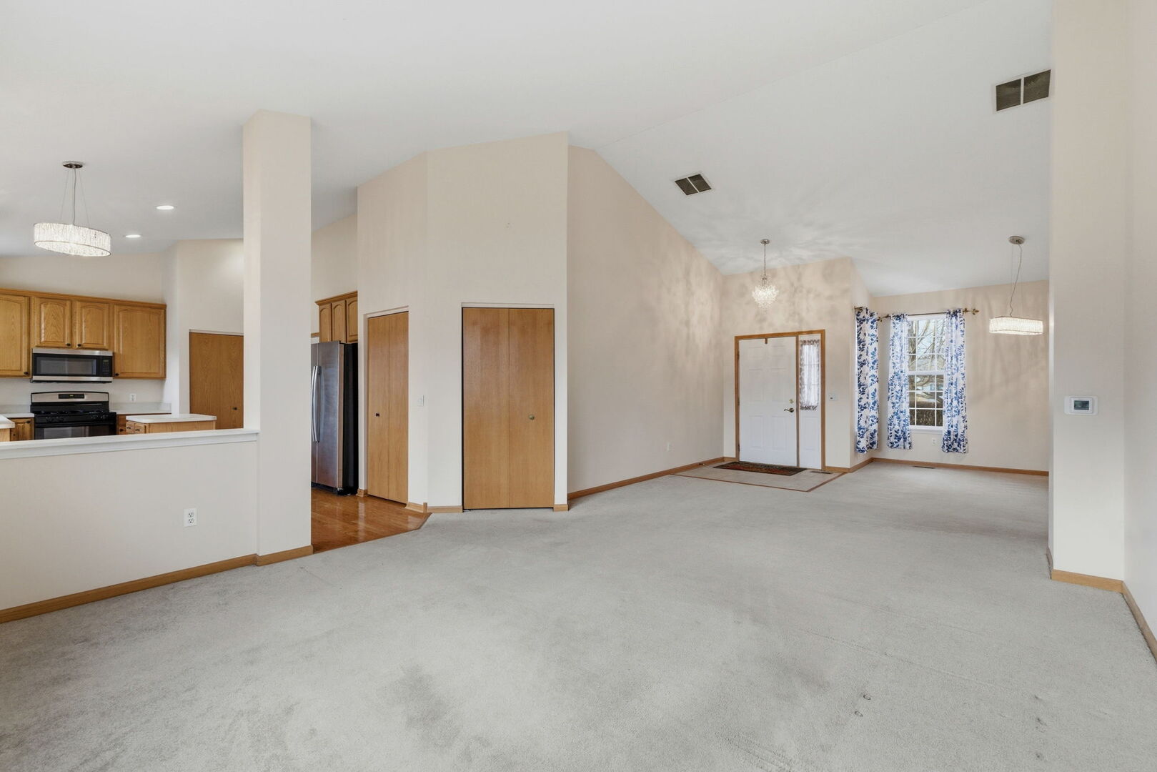 1547 Cadillac Circle Romeoville, IL 60446 - Photo 6 of 21 a view of a kitchen with refrigerator and a sink