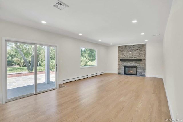 an empty room with windows and an empty room