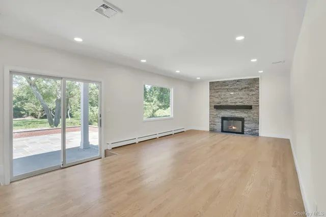 an empty room with windows and an empty room