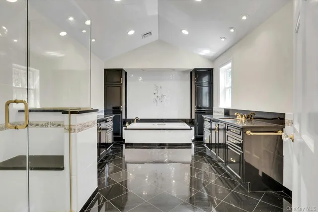 a bathroom with a double vanity sink a toilet and a mirror