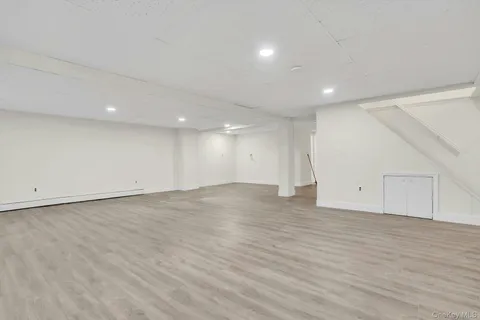 an empty room with wooden floor