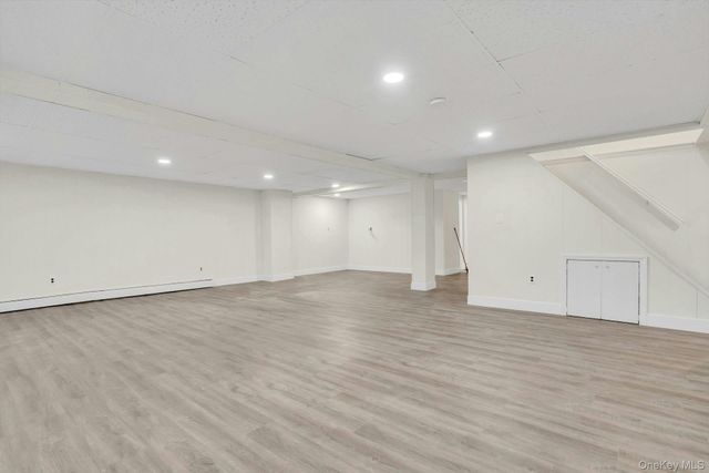 an empty room with wooden floor