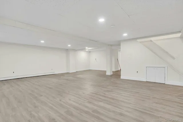 an empty room with wooden floor