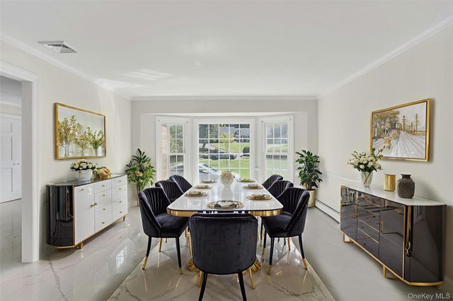 a dining room with furniture and window