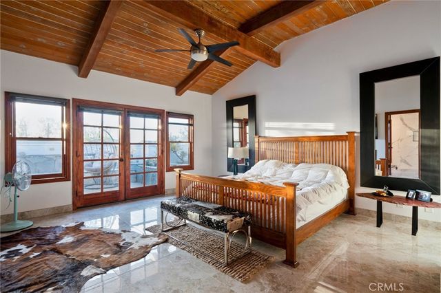 a spacious bathroom with a sink a mirror and shower