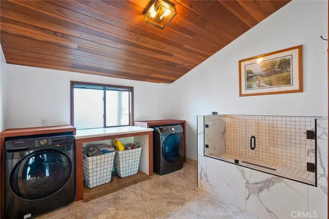 a utility room with dryer and washer