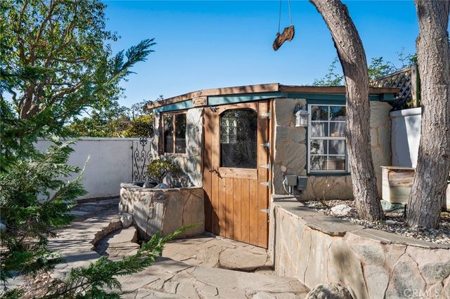 a view of a house with a yard porch and sitting area