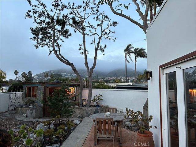 a view of a chairs and table on the terrace