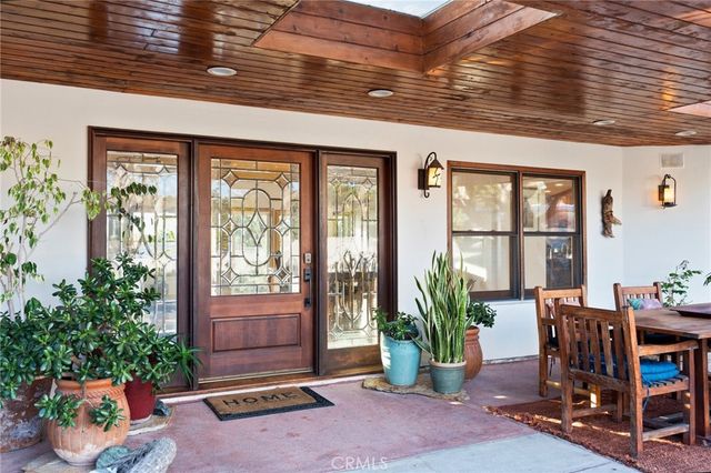 a view of a porch with furniture