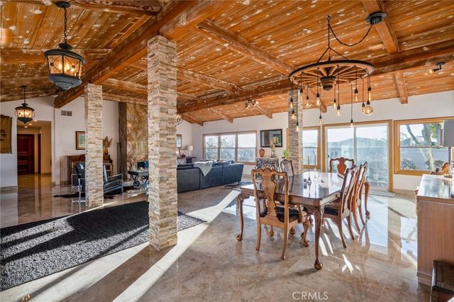 a view of a chairs and tables in patio
