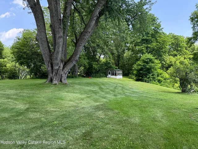 a view of a garage with a bike and a car