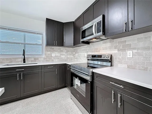 a view of kitchen with wooden floor