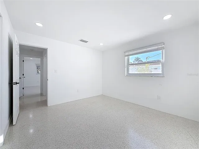 an empty room with windows