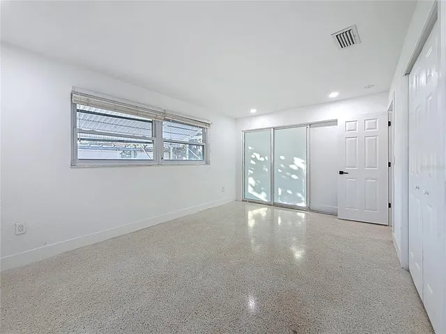 a view of empty room with floor to ceiling window
