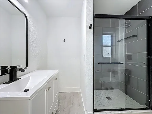 a view of empty room with floor to ceiling window