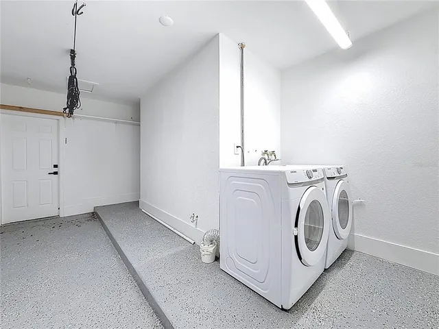 a view of a backyard with swimming pool