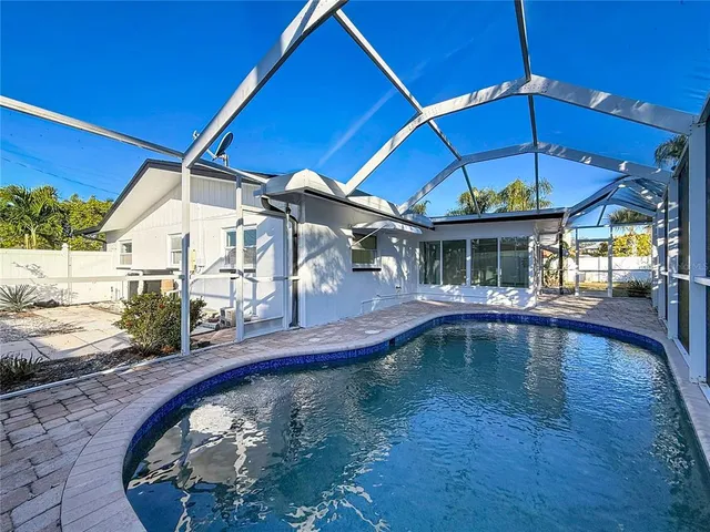 an aerial view of houses with outdoor space