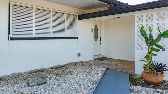 a kitchen with stainless steel appliances a refrigerator and a stove top oven