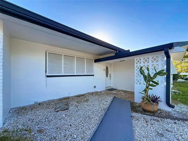 a kitchen with stainless steel appliances a refrigerator and a stove top oven
