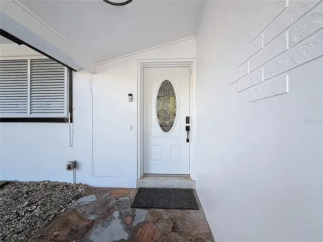 a kitchen with stainless steel appliances granite countertop a sink and a stove
