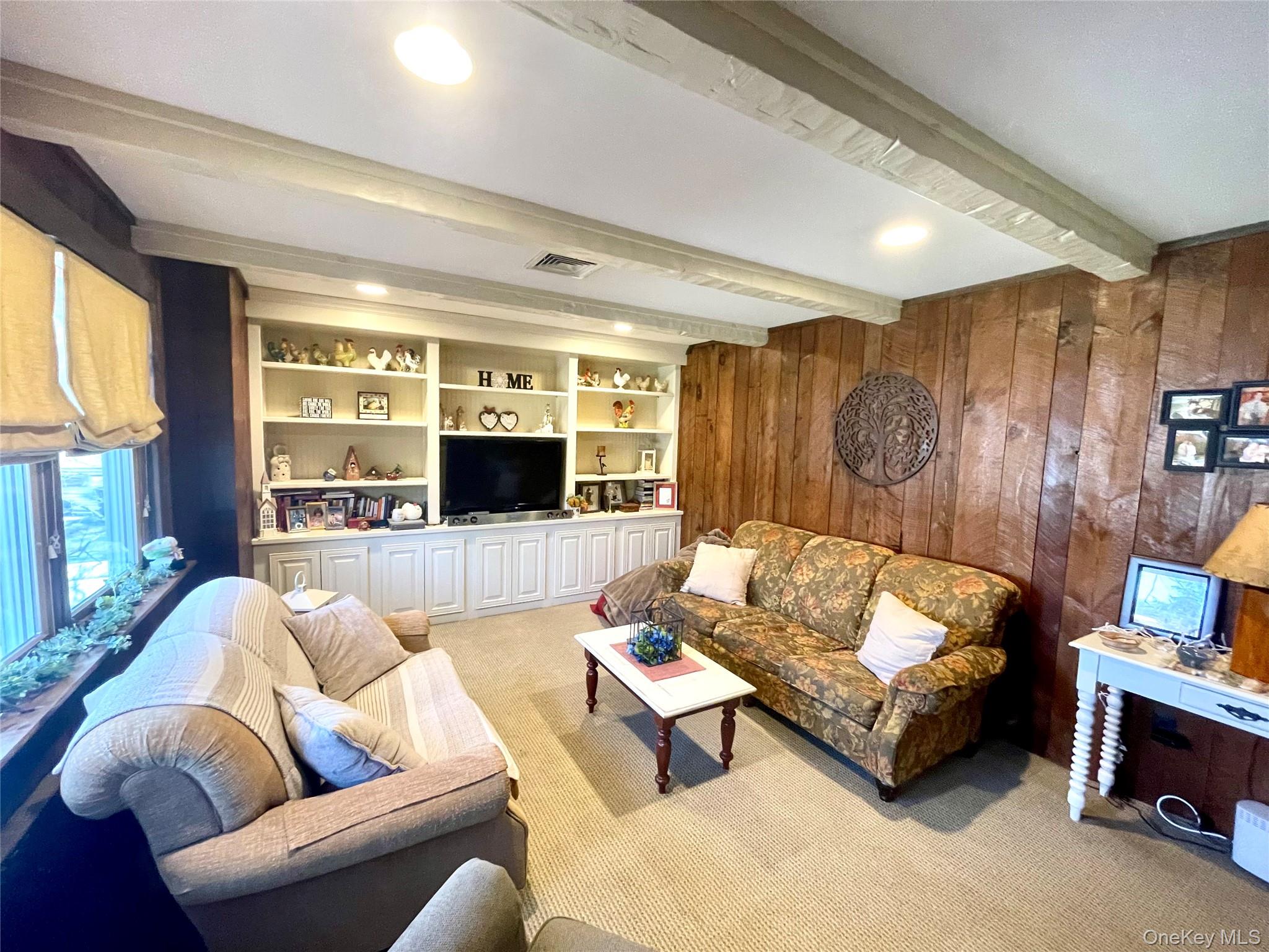 4 Sylvan Way Suffern, NY 10901 - Photo 12 of 39 a living room with furniture and a large window