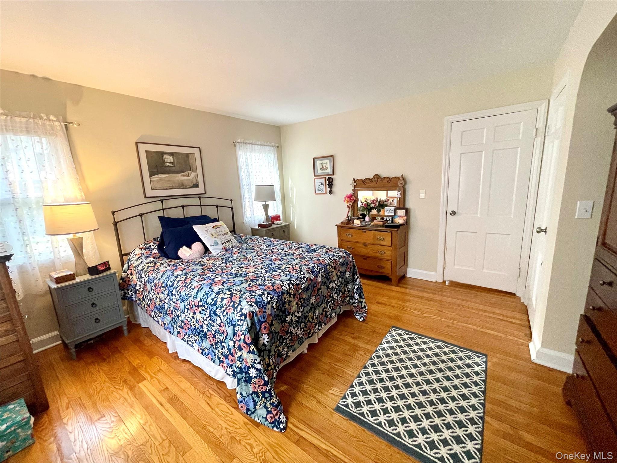 4 Sylvan Way Suffern, NY 10901 - Photo 17 of 39 a bedroom with a bed and wooden floor