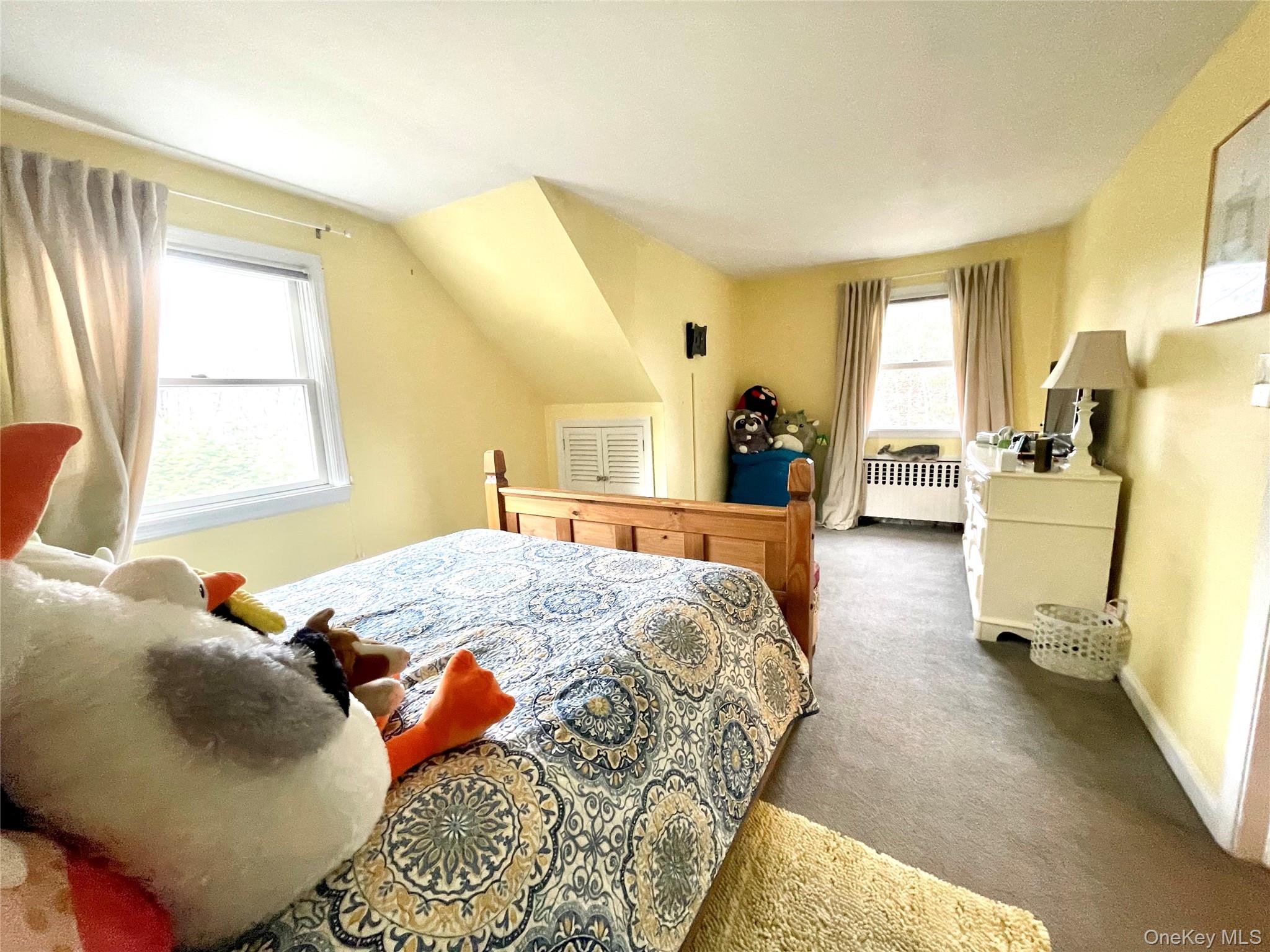 4 Sylvan Way Suffern, NY 10901 - Photo 22 of 39 a bedroom with a bed and wooden floor