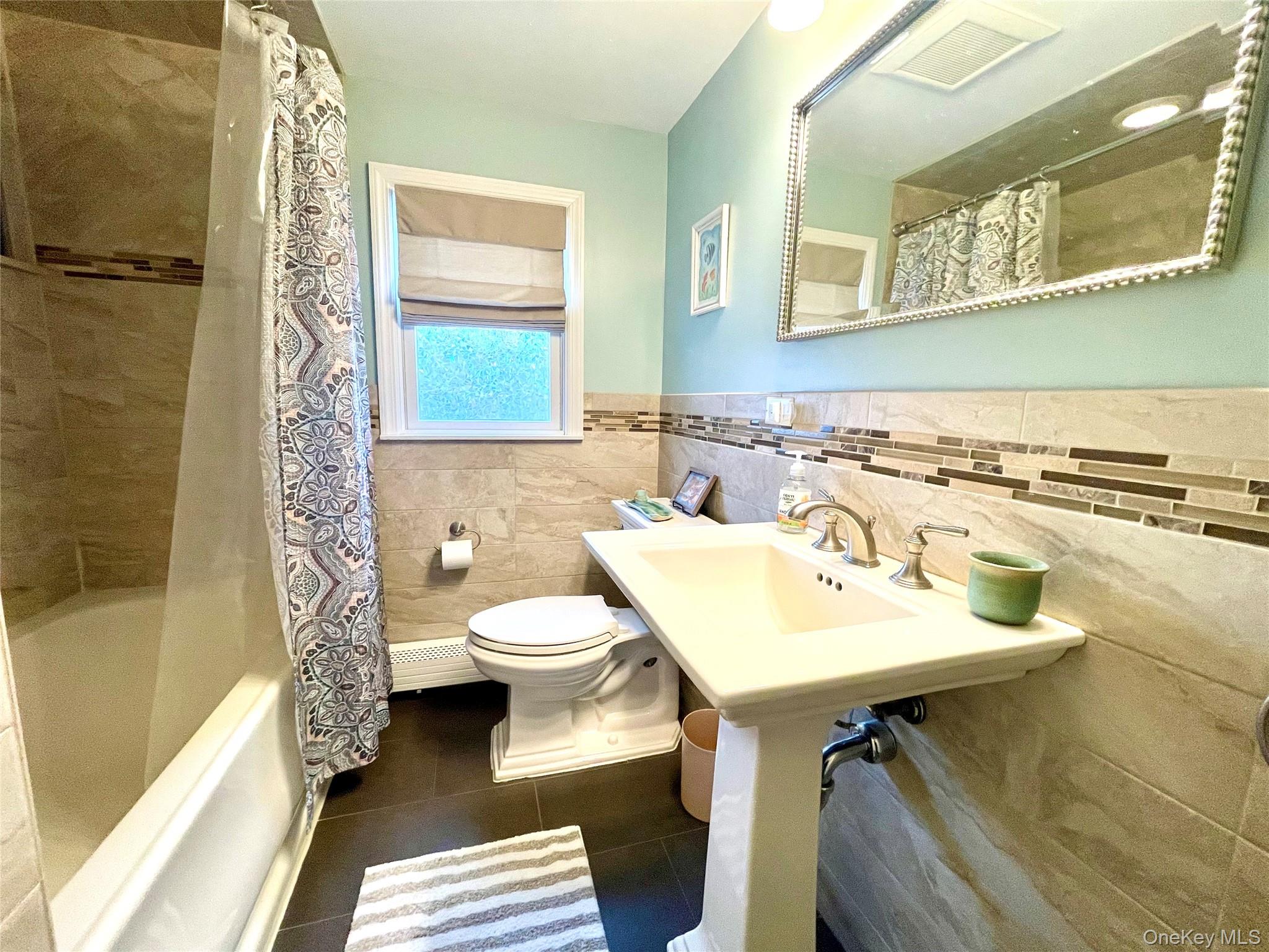 4 Sylvan Way Suffern, NY 10901 - Photo 23 of 39 a bathroom with a sink toilet and shower