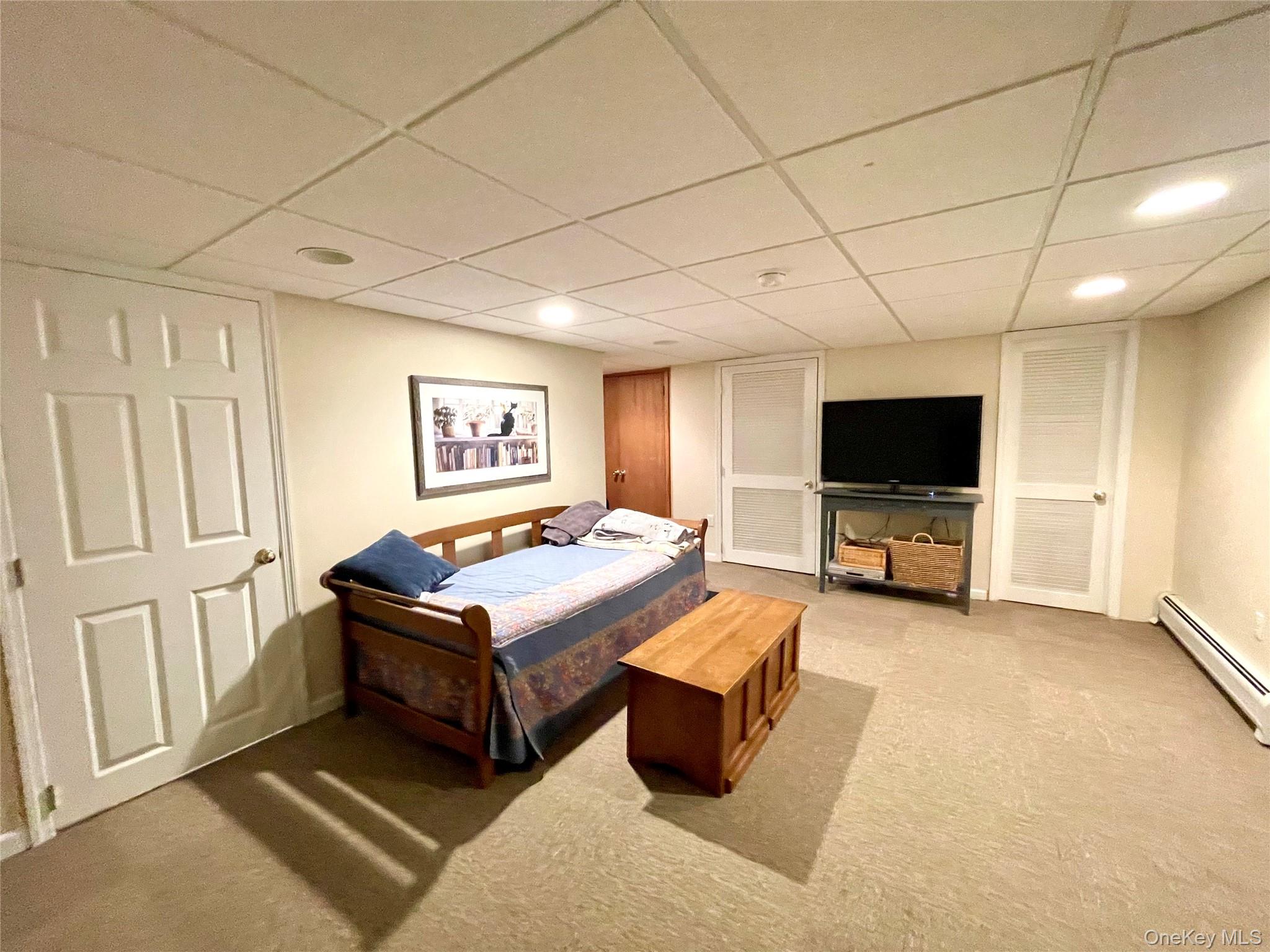 4 Sylvan Way Suffern, NY 10901 - Photo 24 of 39 a living room with furniture and a flat screen tv