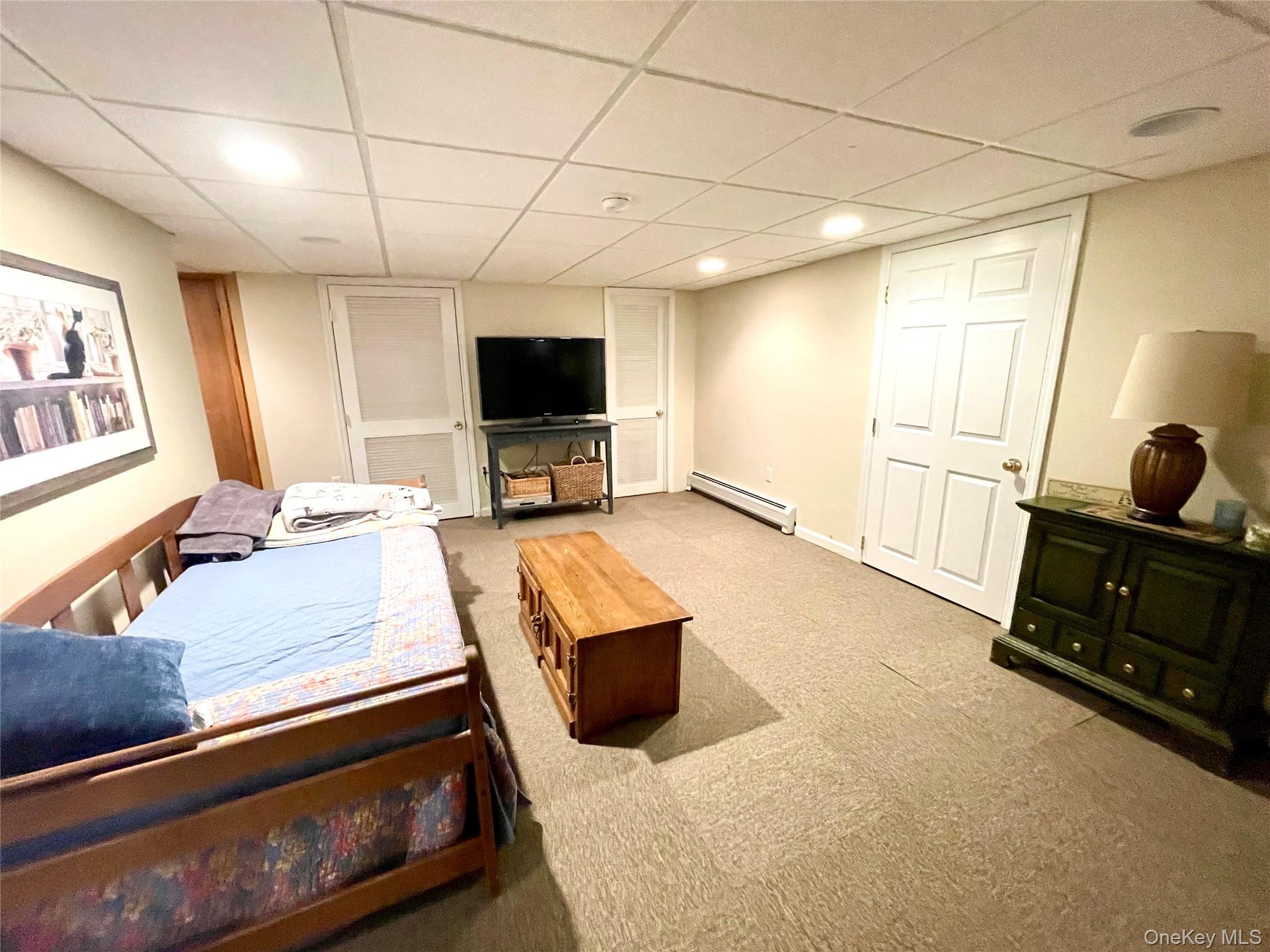 4 Sylvan Way Suffern, NY 10901 - Photo 26 of 39 a bedroom with furniture and a flat screen tv