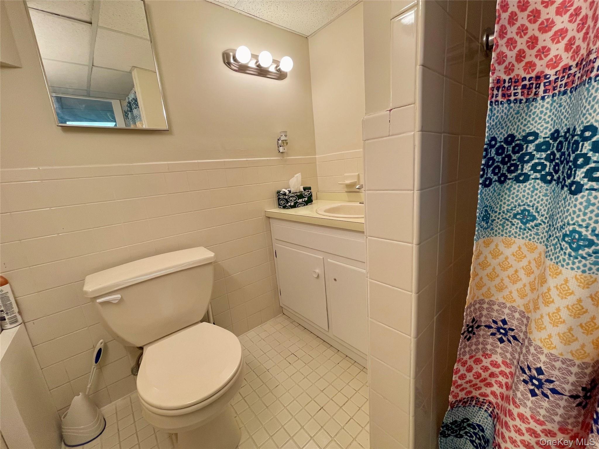 4 Sylvan Way Suffern, NY 10901 - Photo 28 of 39 a white toilet sitting next to a bathroom sink