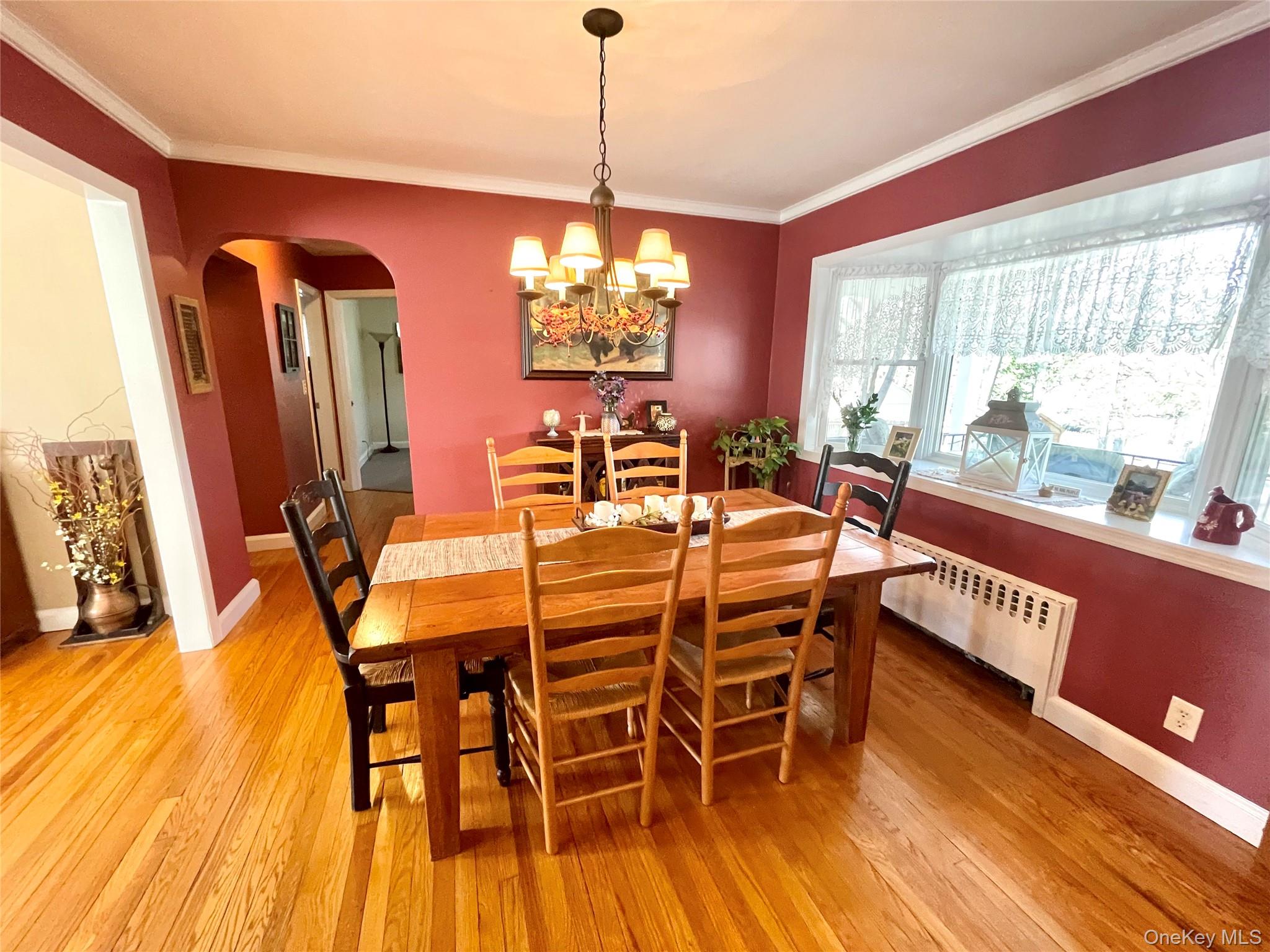 4 Sylvan Way Suffern, NY 10901 - Photo 8 of 39 a dining room with furniture a chandelier and wooden floor