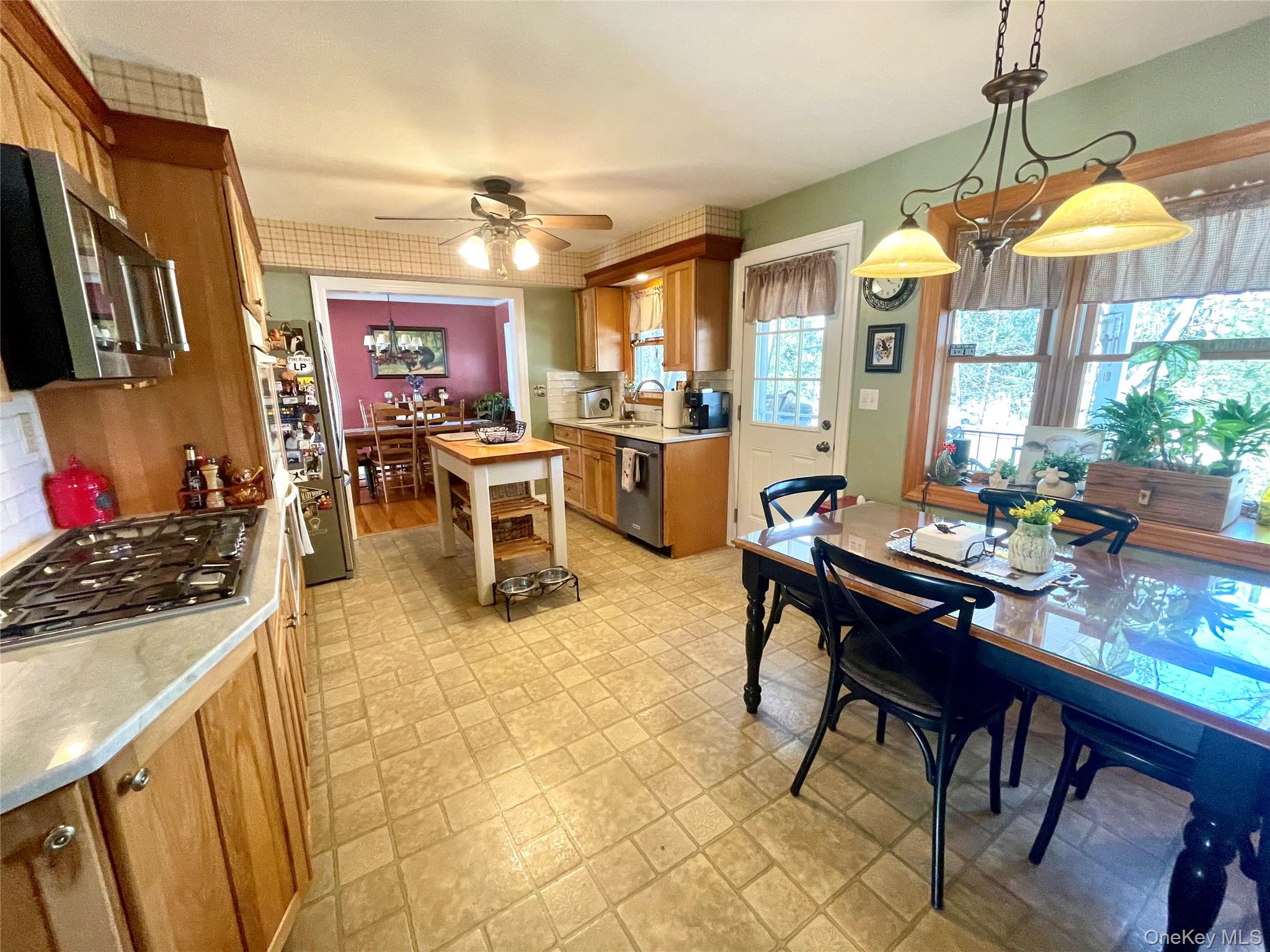 4 Sylvan Way Suffern, NY 10901 - Photo 9 of 39 a view of a dining room with furniture one side kitchen view and a chandelier