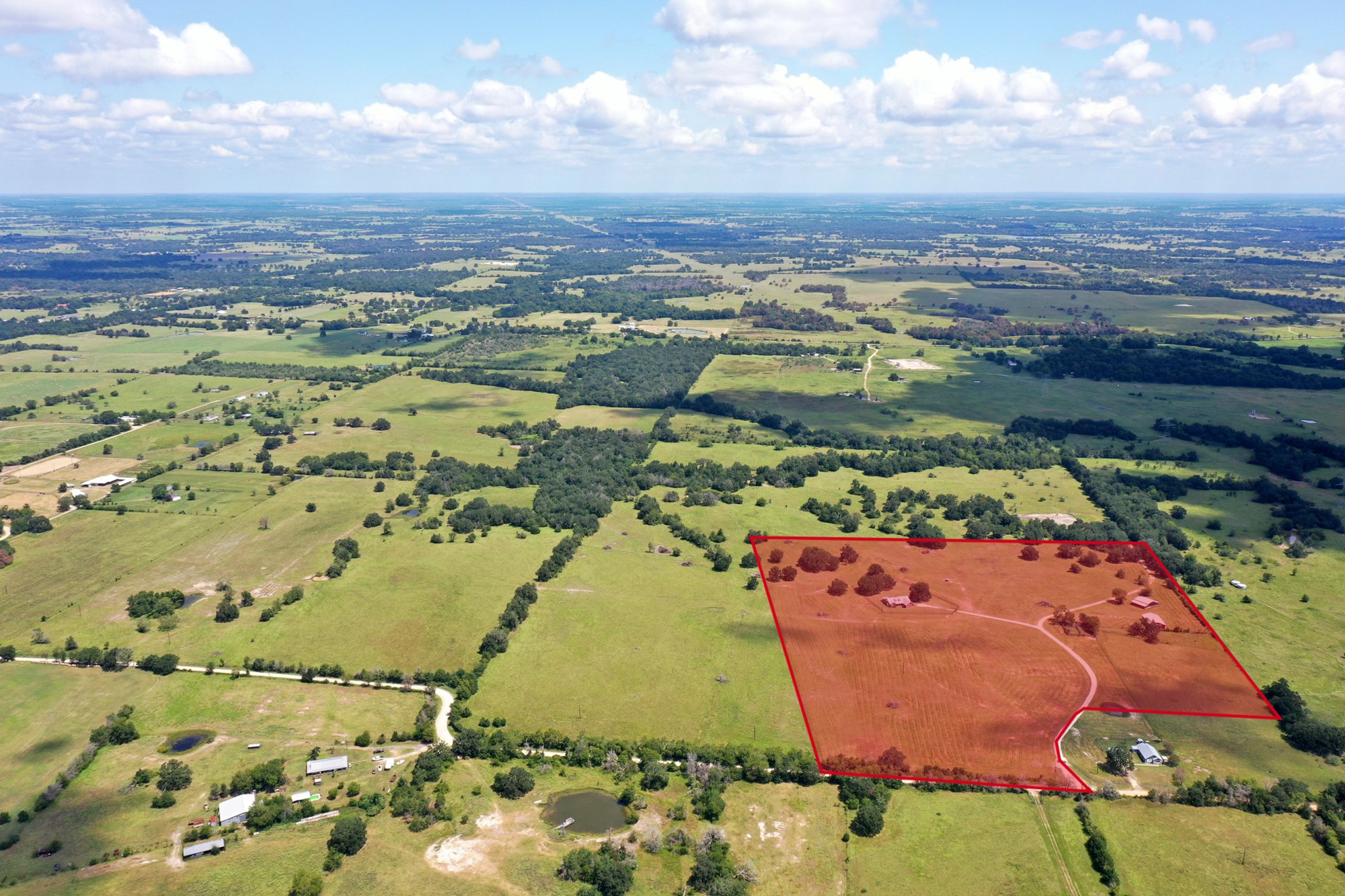 7808 Oxford Cemetery Road Madisonville, TX 77864 - Photo 2 of 16 an aerial view of residential houses with outdoor space