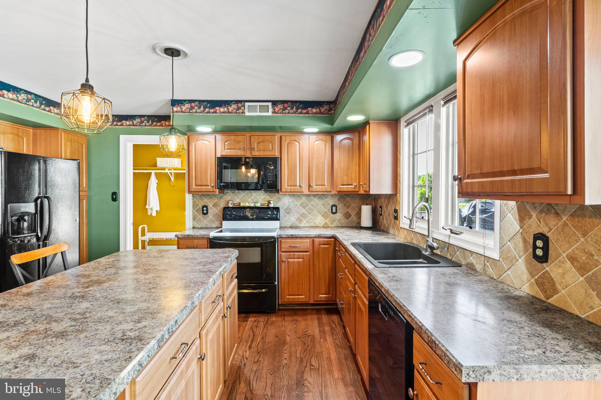 15 Byron Drive Mount Laurel, NJ 08054 - Photo 19 of 60 a kitchen with stainless steel appliances granite countertop a sink a stove and a wooden floors