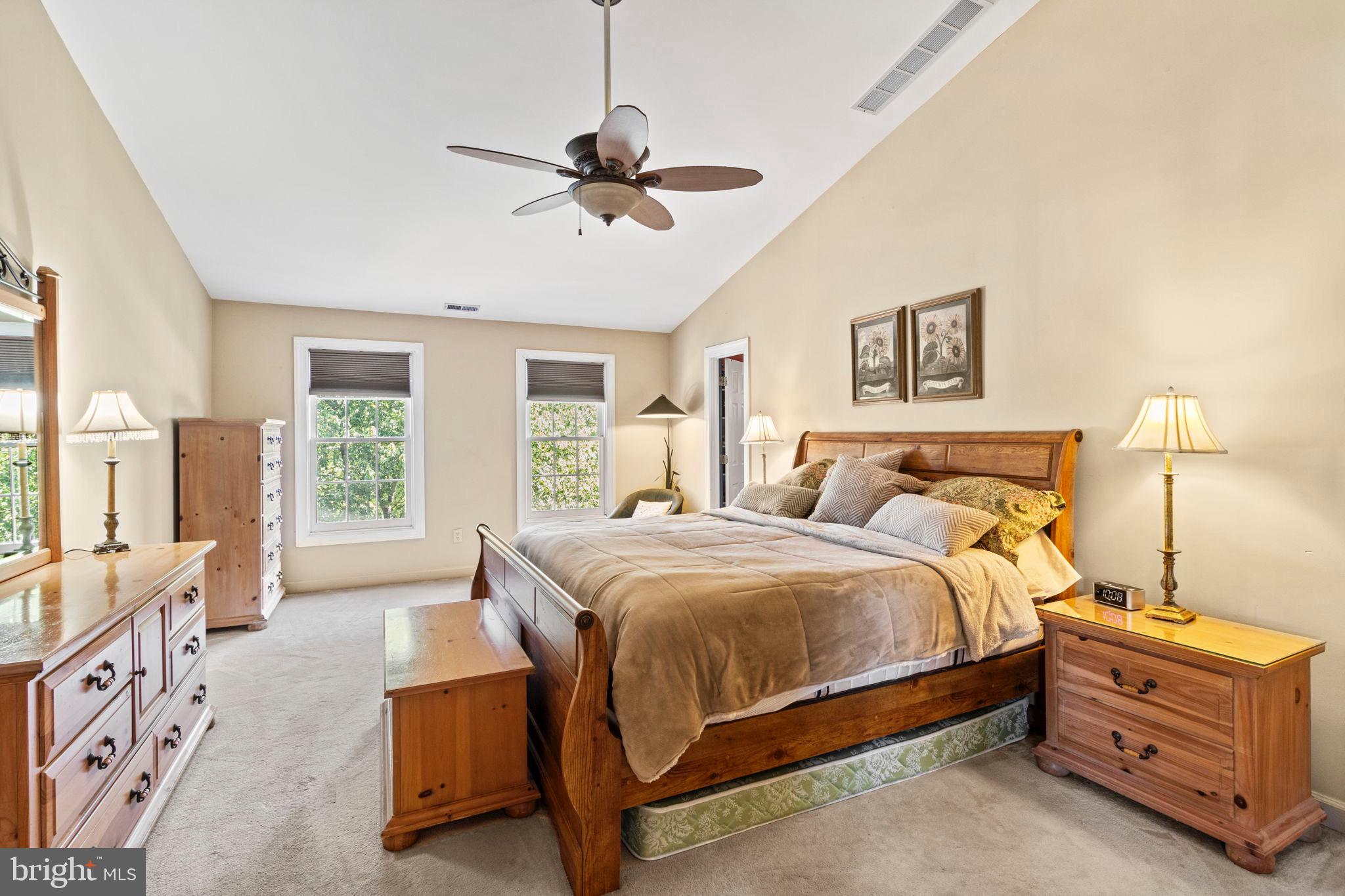 15 Byron Drive Mount Laurel, NJ 08054 - Photo 26 of 60 a spacious bedroom with a bed and a chandelier