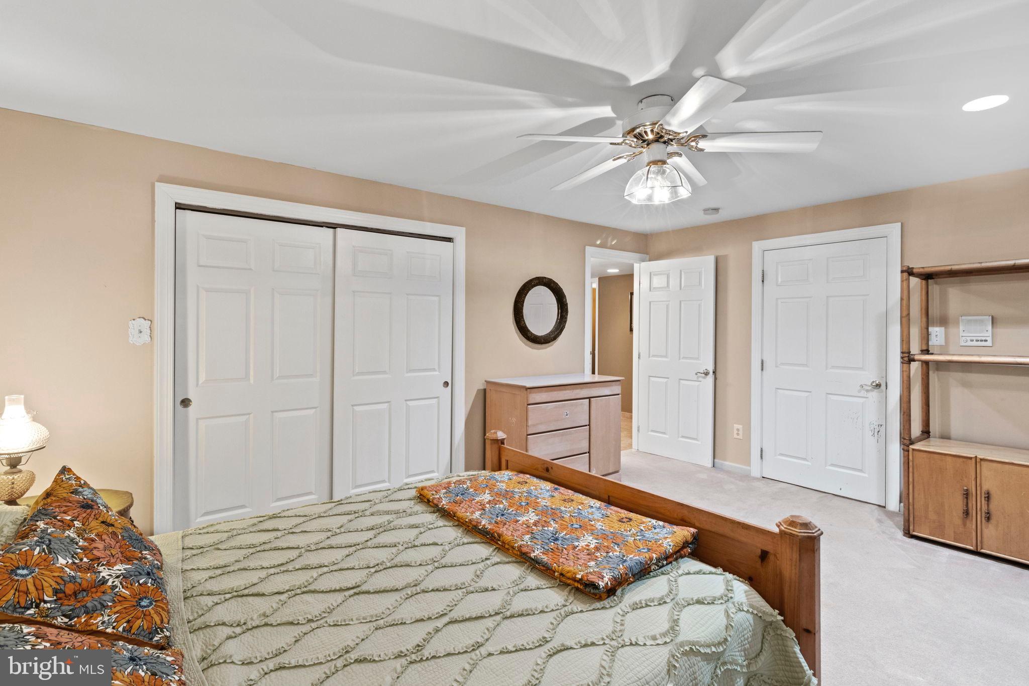 15 Byron Drive Mount Laurel, NJ 08054 - Photo 45 of 60 a bedroom with a bed and a chandelier
