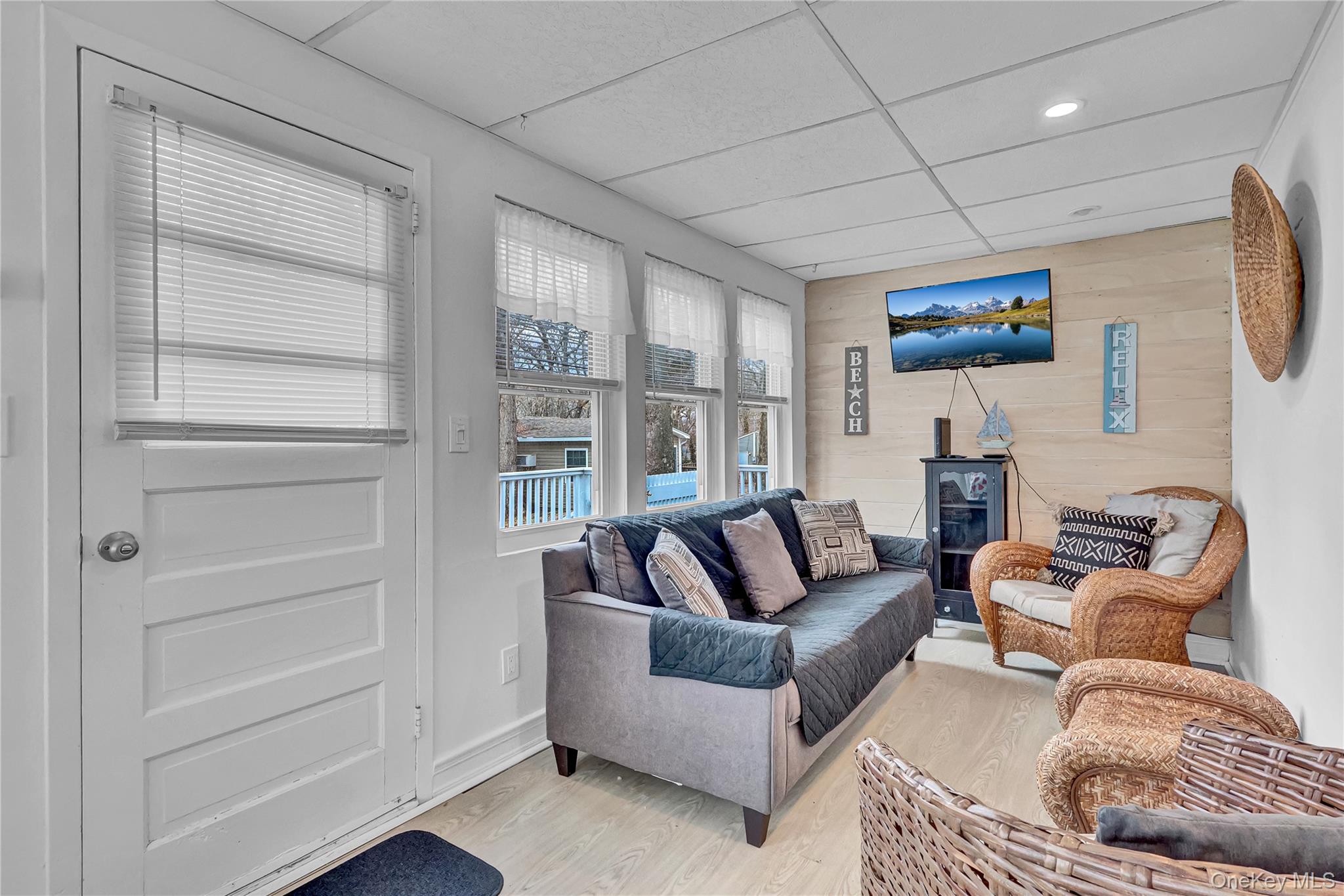 21 Cottage Road Baiting Hollow, NY 11933 - Photo 11 of 28 a living room with furniture and a window