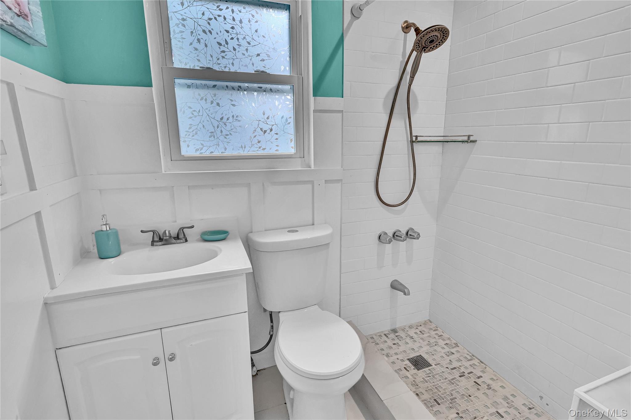 21 Cottage Road Baiting Hollow, NY 11933 - Photo 15 of 28 a bathroom with a sink a toilet and a shower
