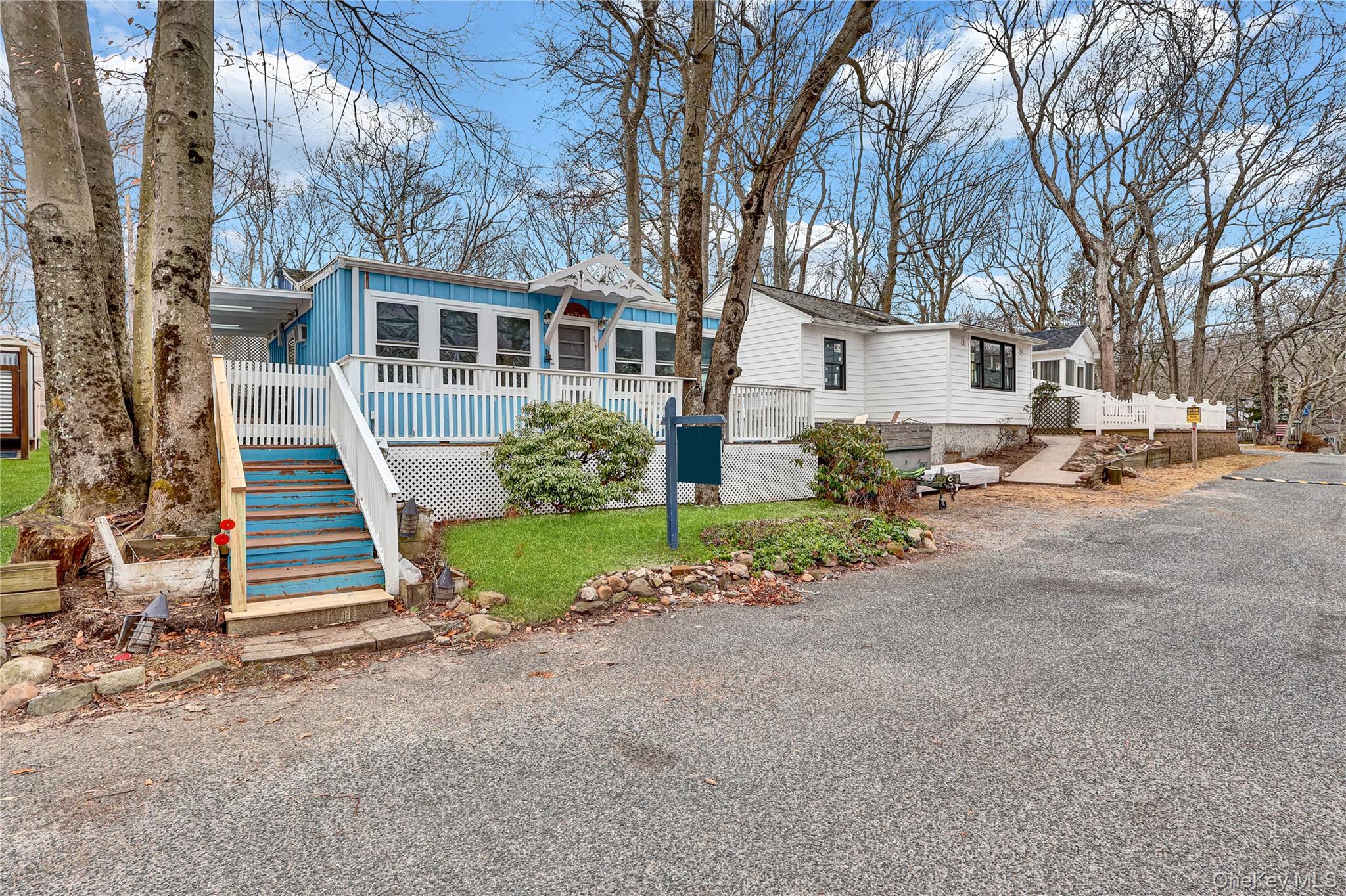 21 Cottage Road Baiting Hollow, NY 11933 - Photo 27 of 28 a front view of a house with a yard
