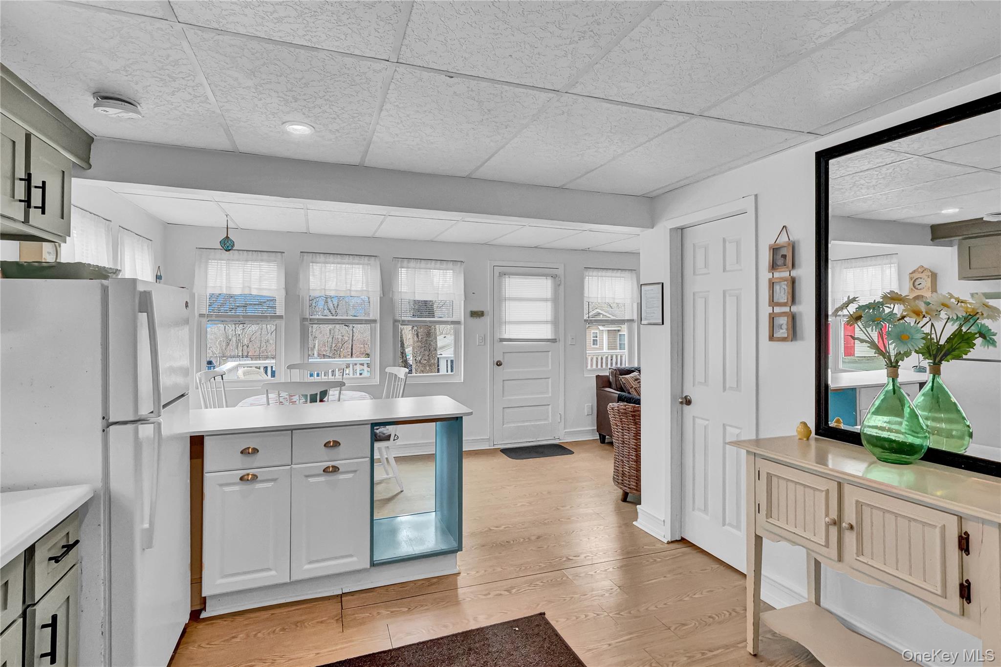 21 Cottage Road Baiting Hollow, NY 11933 - Photo 7 of 28 a view of living room with granite countertop furniture and a fireplace