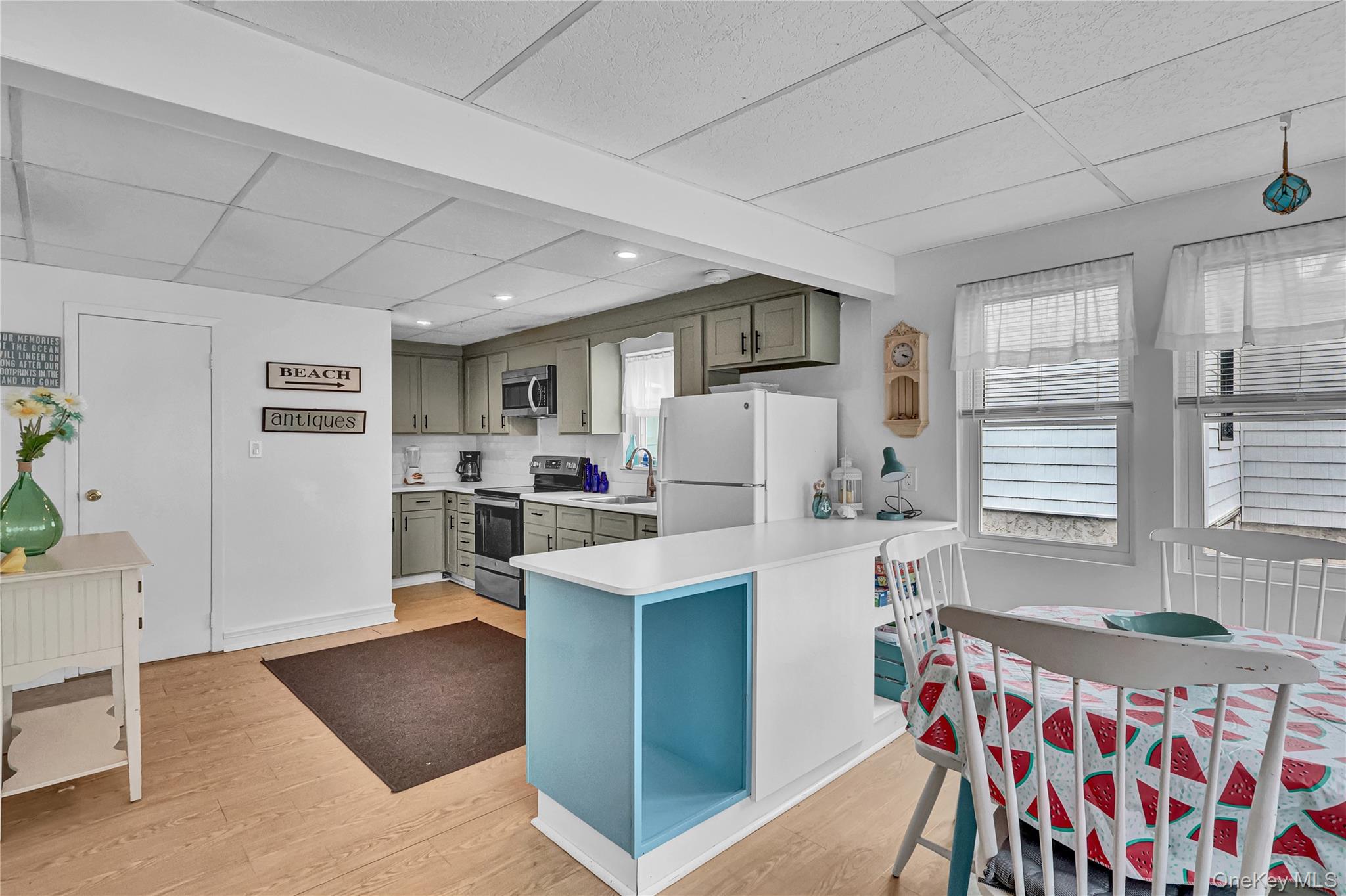21 Cottage Road Baiting Hollow, NY 11933 - Photo 8 of 28 a living room with stainless steel appliances furniture and a window