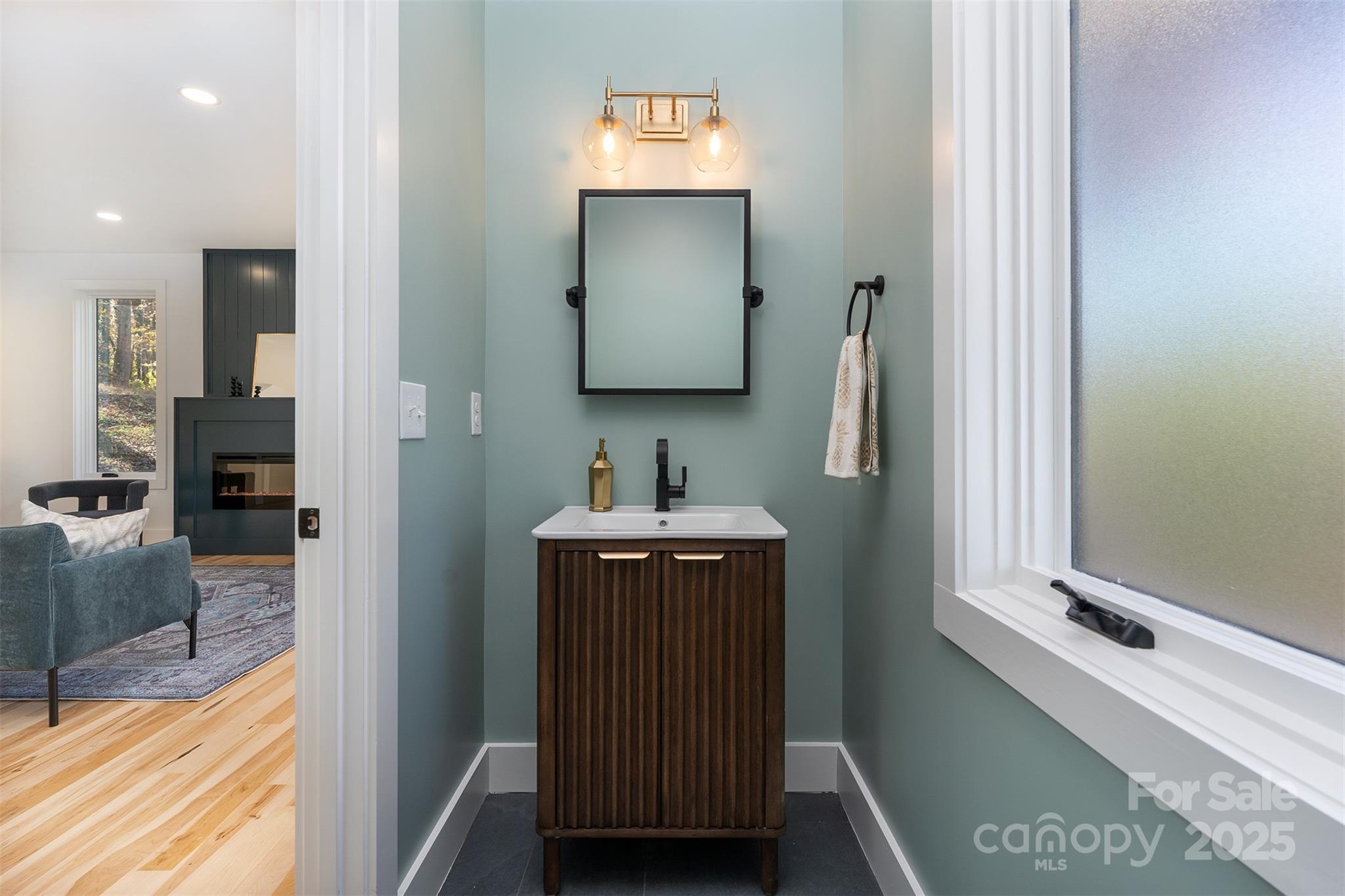 110 Providence Road Asheville, NC 28806 - Photo 16 of 36 a bathroom with a sink and a mirror