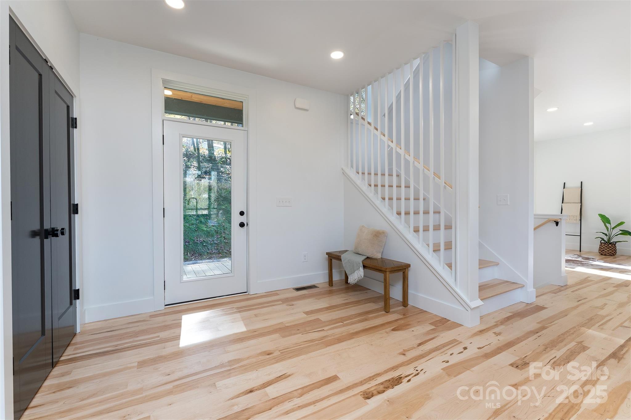 110 Providence Road Asheville, NC 28806 - Photo 17 of 36 a view of entryway with wooden floor and stairs